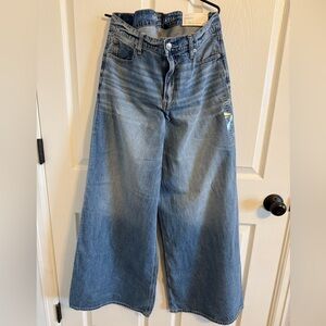 Blue Flare Wide-Leg Jeans with Distressed Details